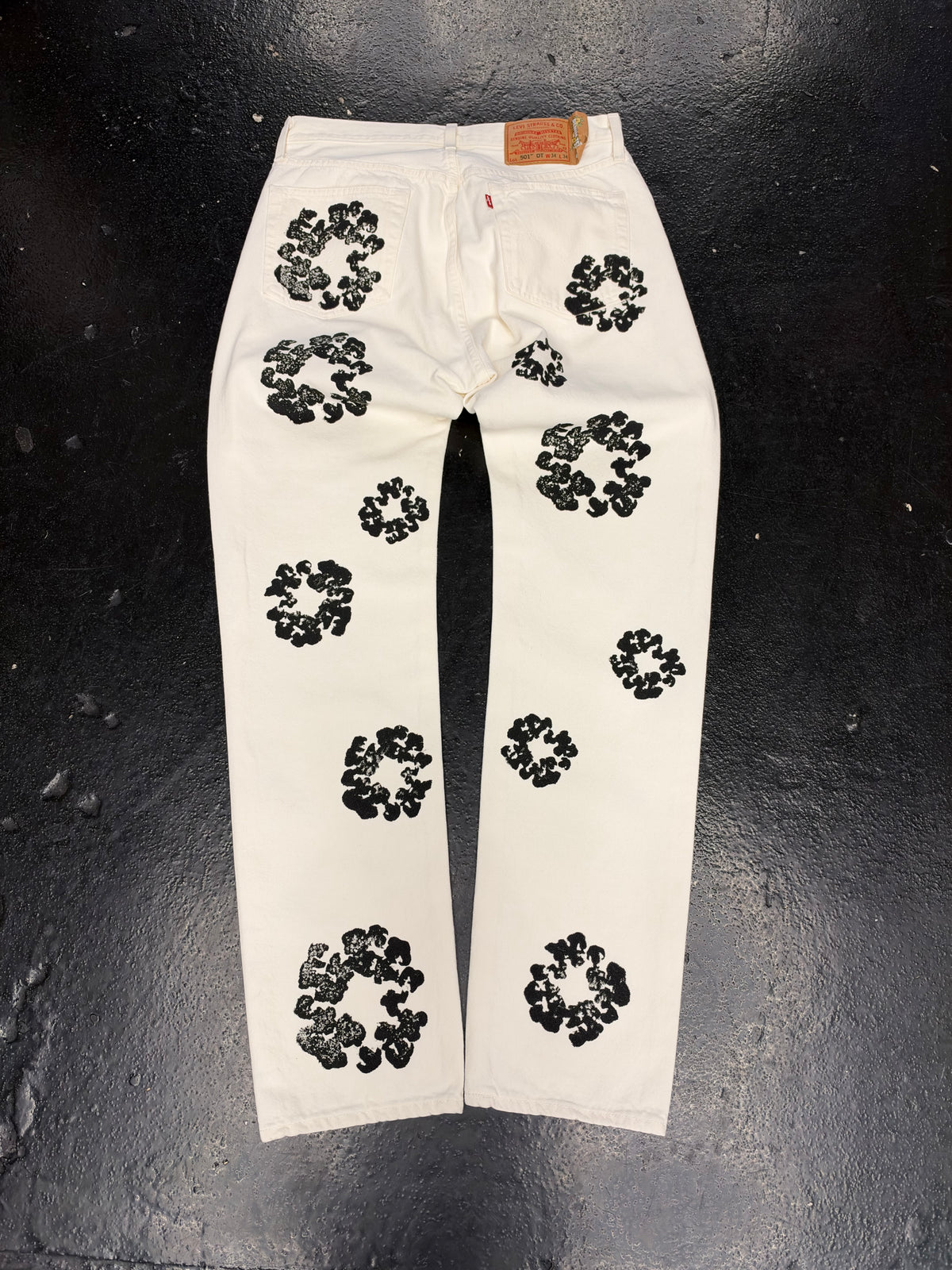 DENIM TEARS WHITE WREATH JEANS (PRE-OWNED)