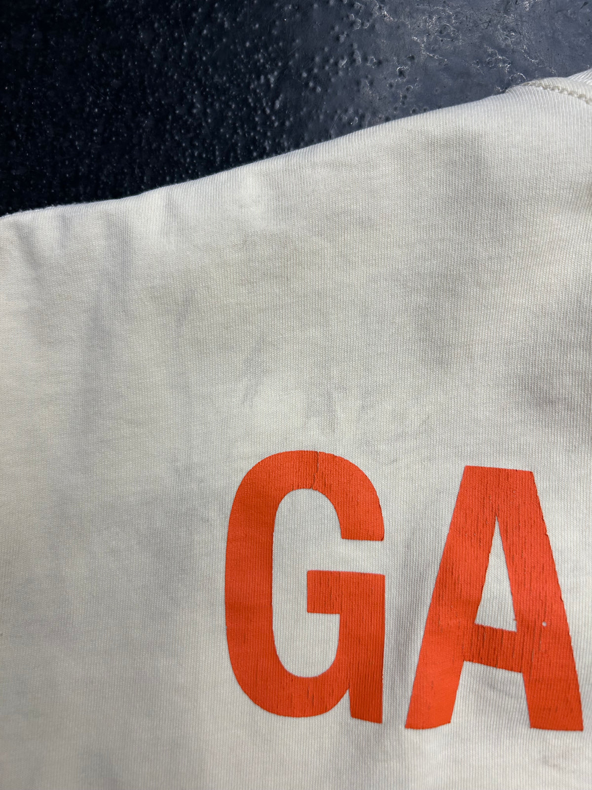 GALLERY DEPT. CREAM /ORANGE TEE (PRE-OWNED W/ STAINED)