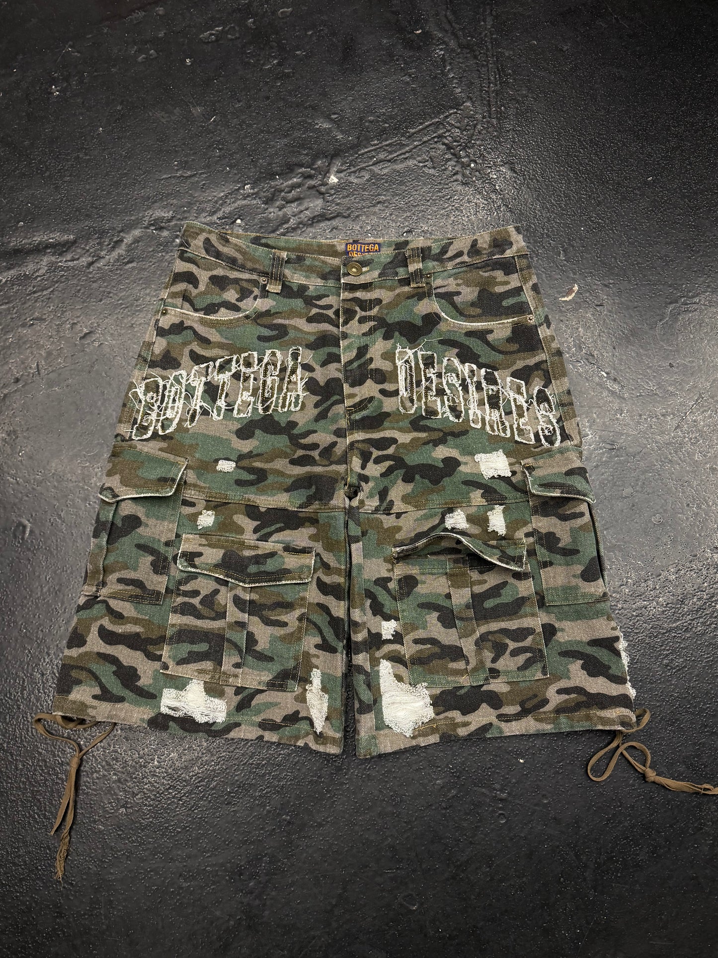 BOTTEGA DESIRES DISTESSED CAMO CARGO SHORTS (PRE-OWNED)